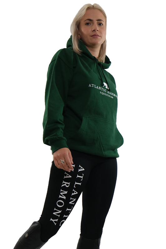 Female wearing equestrian hoodie in bottle green 